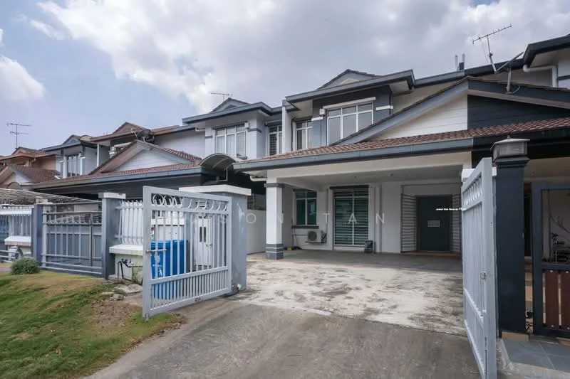 Exterior type: linked terrace house; features: two-storey building, grey painted facade, gabled roof with tiles, front porch area, driveway with concrete surface, fenced front yard, manicured lawn, visible air conditioning units, multiple windows, main entrance door, side gate access; style: modern.