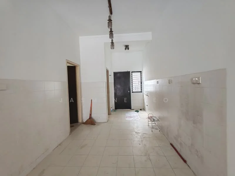 Room features: white painted walls, cream tiled flooring, ceiling lights, doorway leading to another room, black security door, window with metal grille, broom on the floor, empty wall space, light fixture on ceiling.