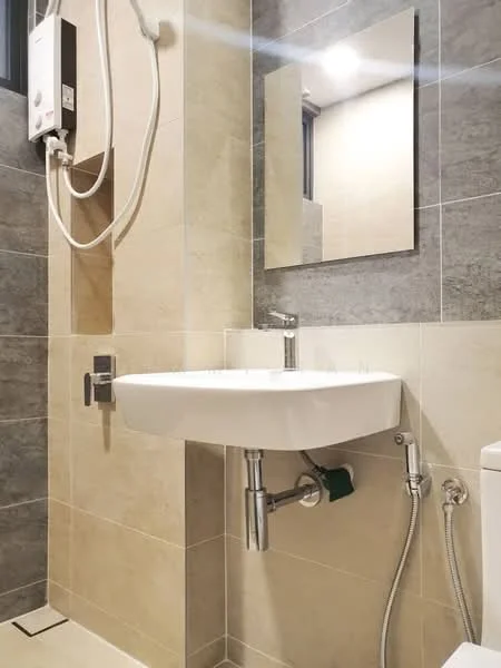 Bathroom features: wall-mounted sink, chrome faucet, mirror above sink, grey tiled walls, beige tiled walls, shower head with wall-mounted controls, toilet, chrome plumbing fixtures, floor tiles, shower area, lighting above mirror; style: modern.