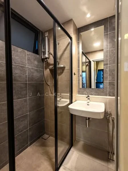 Bathroom features: walk-in shower with glass enclosure, rain shower head, handheld shower, single-sink vanity with wall-mounted faucet, mirror above sink, grey tiled walls, light-colored floor tiles, toilet with bidet spray, chrome towel rail, recessed lighting; style: modern.