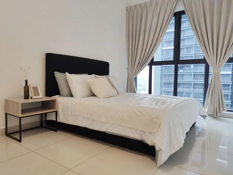 Bedroom features: king-size bed with black upholstered headboard, white bedding with striped pattern, nightstand with wooden top and metal legs, decorative vase with flowers, floor-to-ceiling windows, sheer curtains, white painted walls, glossy tile flooring; style: modern; view: city.
