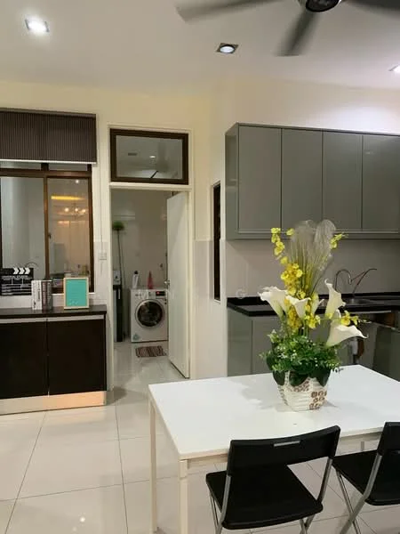 Kitchen features: grey cabinetry, black countertop, white walls, recessed downlights, floor-to-ceiling windows, white tiled flooring, kitchen sink, stainless-steel appliances, dining table with white surface, black dining chairs, decorative flower arrangement; style: modern. Laundry features: washing machine, door leading to laundry area.
