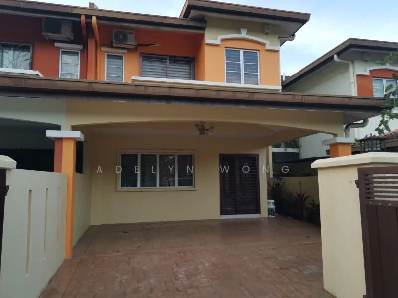 Exterior type: semi-detached house; features: orange and cream painted facade, flat roof, covered car porch, decorative chandelier at entrance, exposed brick wall, manicured landscaping, paved driveway, single wooden door, air conditioning units visible, fenced front yard; style: modern.