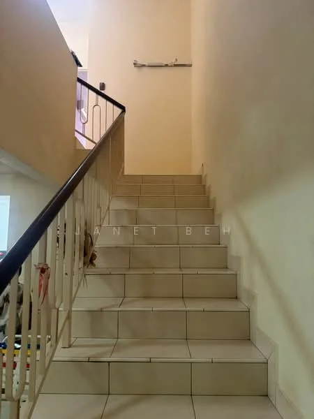 Room features: white painted walls, ceramic tile flooring, staircase with handrail, light fixture on wall, neutral color scheme.