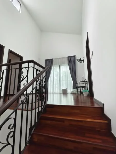 Room features: wooden staircase, dark wood railing with decorative metalwork, white painted walls, large window with sheer curtains, grey curtains, wooden flooring, small side table, wall-mounted lamp; style: modern.
