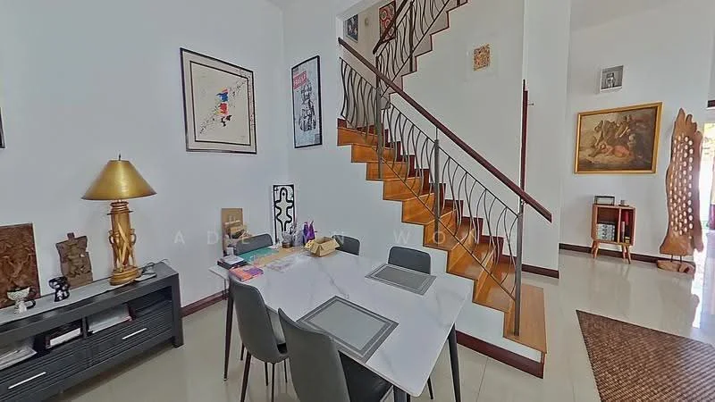 Dining features: white walls, cream tiled flooring, wooden staircase, metal railing, dining table with place settings, four grey dining chairs, decorative wall art, table lamp, console table, framed artwork, wooden sculpture, area rug; style: modern.