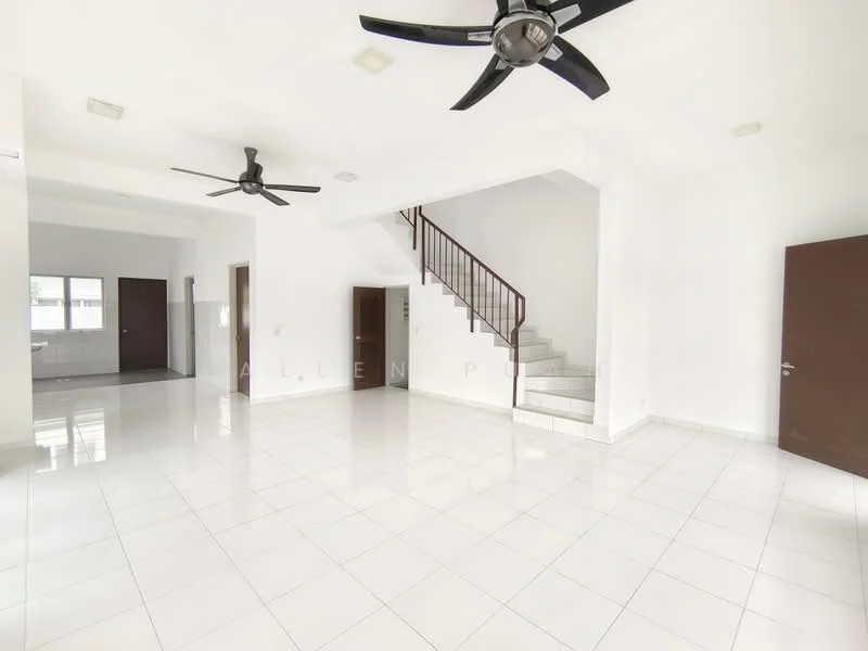 Living features: white painted walls, glossy white tile flooring, 2 ceiling fans, staircase with wooden railing, large windows for natural light, open layout, no visible furniture, neutral color scheme; style: modern. Kitchen features: white painted walls, glossy white tile flooring, kitchen area visible in background, no visible appliances, open layout to living area; style: modern.