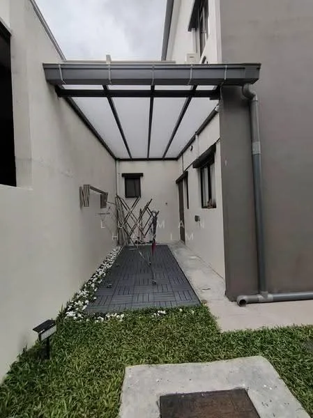 Exterior features: covered walkway with transparent roofing, grey tiled flooring, white painted walls, drainage pipe, landscaped area with grass, flower bed with white flowers, windows with black frames; style: modern.