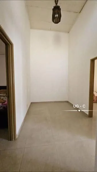 Room features: white painted walls, plain ceiling, tile flooring, single pendant light fixture, doorway leading to another room, doorway leading to hallway.