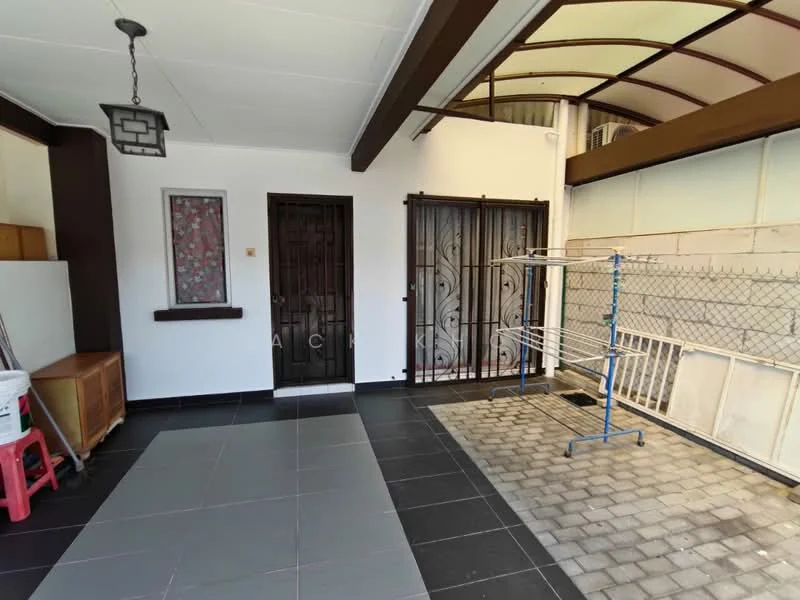Room features: black tiled flooring, white painted walls, wooden ceiling beams, hanging light fixture, double door with decorative grille, single door, clothes drying rack, brick paved area, wooden storage cabinet; style: modern.