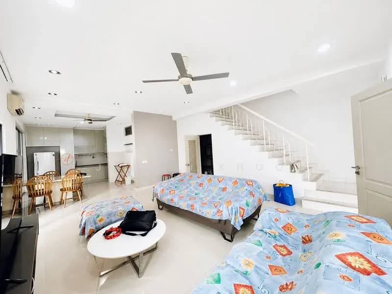 Living features: 2 single beds with colorful bedspreads, 3-blade ceiling fan, wall-mounted TV, coffee table, sofa chairs, staircase leading to upper floor, white painted walls, tile flooring, large windows for natural light, open layout to kitchen area; style: modern.