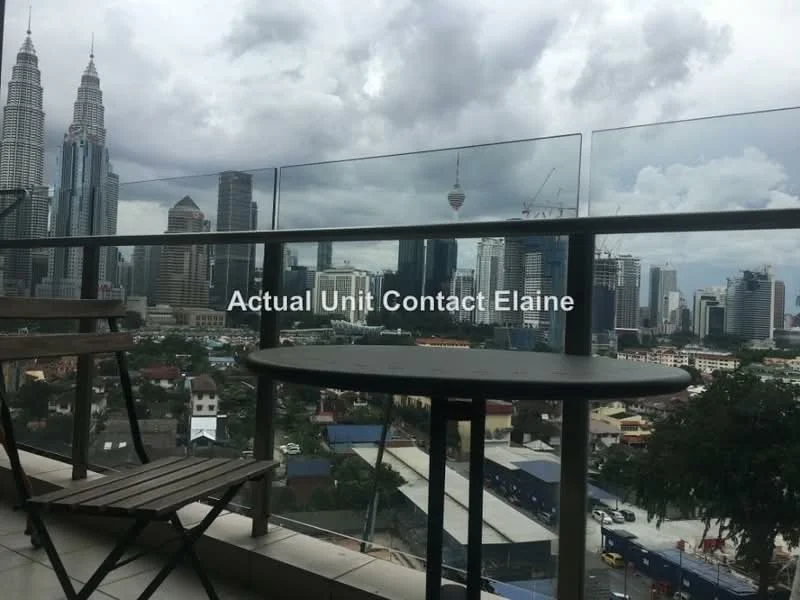 Balcony features: glass railing, outdoor table, wooden folding chairs, city skyline view, cloudy sky; style: modern; view: city.