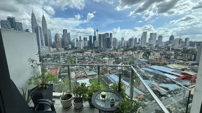 Balcony features: glass railing, outdoor seating, small round table, potted plants, city skyline view, floor tiles, sunny exposure; style: modern; view: city.