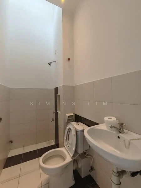 Bathroom features: white ceramic toilet, single-sink vanity with chrome faucet, wall-mounted mirror, shower head, white tiled walls, dark tiled flooring, exposed plumbing, high ceiling with skylight; style: modern.