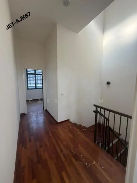 Room features: wood flooring, white painted walls, staircase with metal railing, window with grid pattern, natural light from window, high ceiling, doorway leading to another room; style: modern.