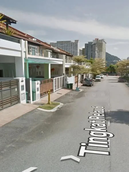 Exterior type: linked terrace house; features: two-storey linked terrace houses, white painted facade, balconies on upper floors, manicured front gardens, paved driveway, street view with road signage, surrounding high-rise buildings, trees lining the street; style: modern.