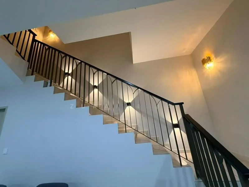 Room features: wooden staircase, black metal railing, wall-mounted lighting fixtures, neutral painted walls, laminate flooring, recessed lighting, open space above staircase; style: modern.