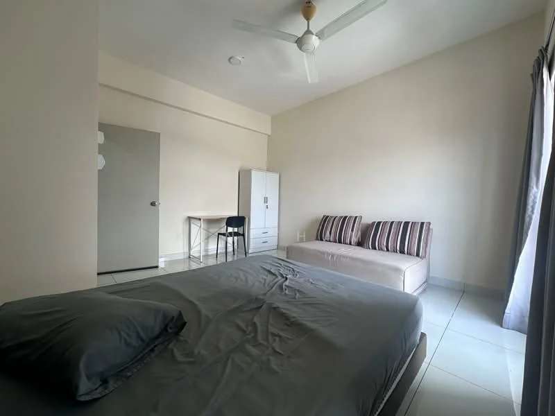 Bedroom features: queen-size bed with grey bedding, sofa with striped cushions, white wardrobe, study desk with chair, ceiling fan, floor-to-ceiling window with sheer curtains, white painted walls, glossy tile flooring; style: modern.