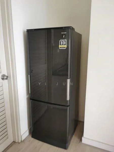 Room features: black fridge.
