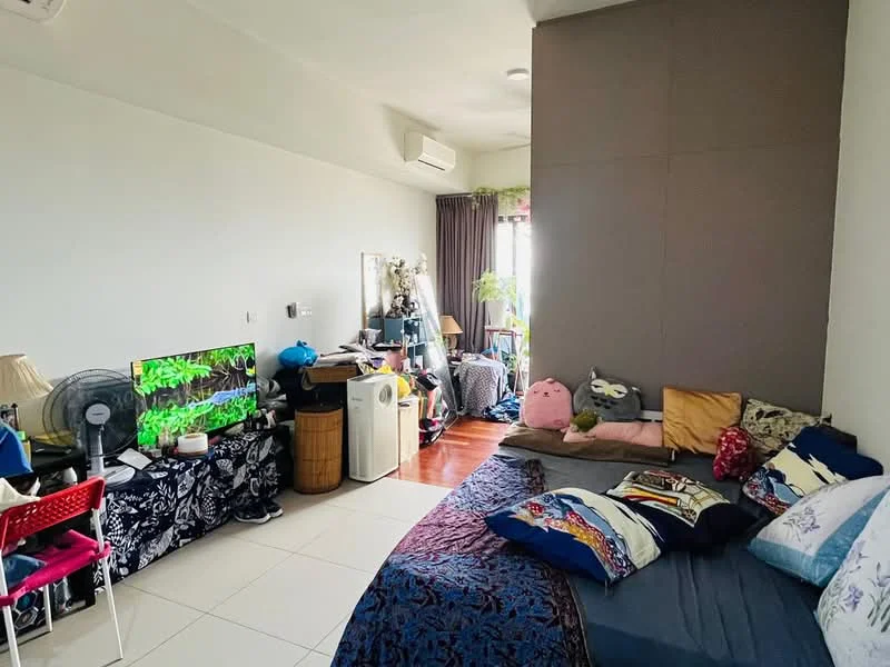 Room features: light-coloured painted walls, wood flooring, large window with sheer curtains, floor-mounted air conditioning unit, TV on console, decorative plants, bed with multiple cushions and throws, small table with decorative items, fan on a stand, laundry basket, storage cabinet, decorative plush toys; style: modern; view: city.