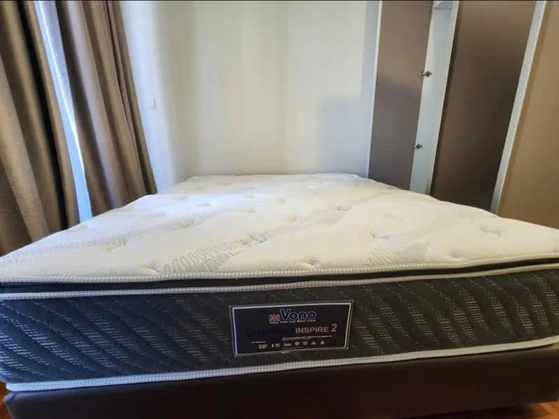 Room features: queen-size mattress, grey upholstered bed frame, neutral-coloured bedding, curtains in beige, built-in wardrobe with sliding doors, light-coloured walls, wooden flooring; style: modern.