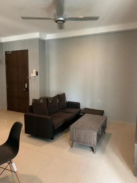 Living features: 3-seater fabric sofa in dark brown, wooden coffee table, light-colored tiled flooring, grey painted walls, ceiling fan, wall-mounted intercom, main entrance door, decorative wall with no visible artwork; style: modern.