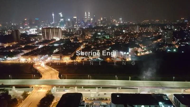Exterior type: high-rise condominium; features: city skyline view, nighttime lighting, surrounding urban landscape, highway visible, streetlights, multiple high-rise buildings, green spaces in the foreground; style: modern.