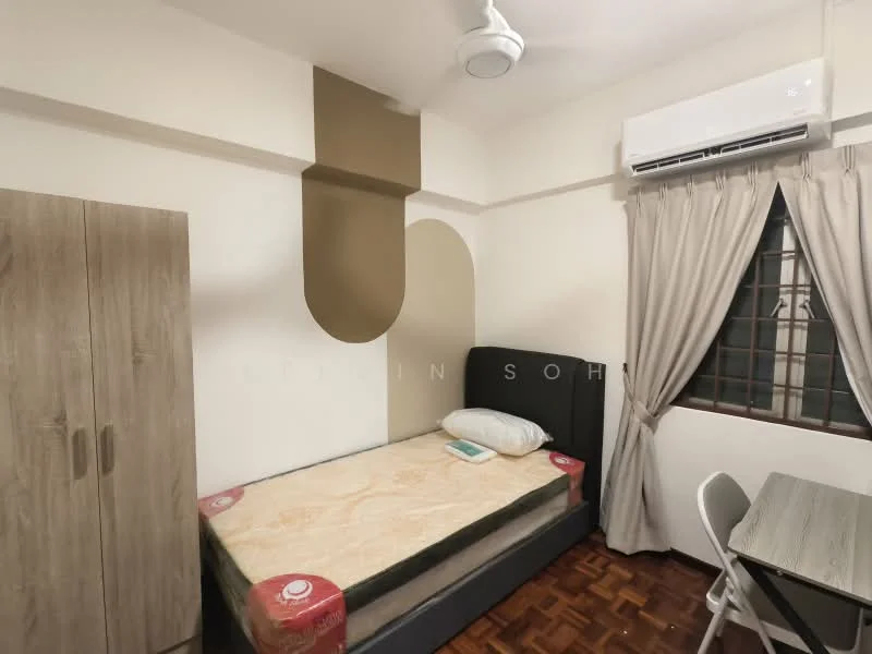 Bedroom features: single bed with mattress, wooden wardrobe, ceiling fan, air conditioning unit, wooden flooring, cream painted walls, curtains, window with grid, study desk and chair.