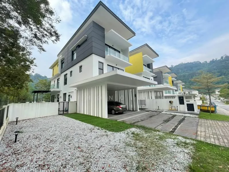 Exterior type: linked terrace house; features: white painted facade, grey accent wall, yellow accent wall, flat roof, double-storey, car porch with awning, manicured lawn, gravel landscaping, paved driveway, surrounded by greenery, mountain view in background; style: modern.