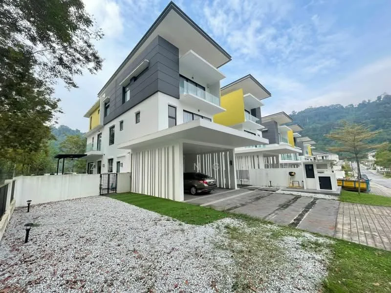 Exterior type: linked terrace house; features: white painted facade, grey accent wall, yellow painted facade, flat roof, double-storey, car porch with awning, manicured lawn, gravel landscaping, paved driveway, surrounded by greenery, mountain view in background; style: modern.