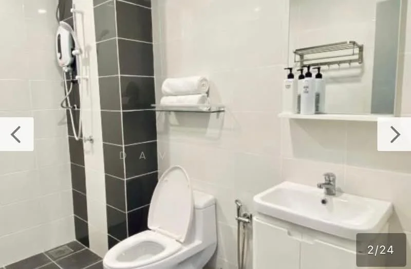 Bathroom features: white tiled walls, black accent wall, grey floor tiles, one-piece toilet, wall-mounted basin, chrome basin mixer faucet, shower with handheld showerhead, towel rack, shelves for toiletries, soap dispensers; style: modern.