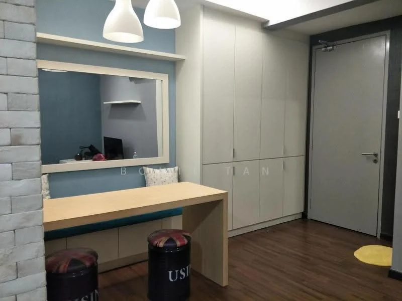 Room features: wooden flooring, blue accent wall, white painted walls, large mirror, built-in cabinetry, desk with wooden surface, two stools, door, TV visible in background, sconce lighting; style: modern.