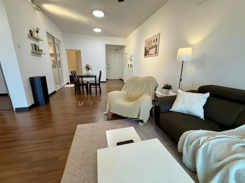 Living features: dark brown leather sofa, white throw blanket, white decorative pillow, light-colored area rug, coffee table, wall-mounted light fixture, floor lamp, wooden flooring, open layout, dining area visible, neutral wall color, decorative artwork on wall; style: modern. Dining features: 4-seater dining table, black dining chairs, neutral wall color, wooden flooring; style: modern.