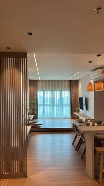 Living features: wooden flooring, recessed downlights, pendant lighting, floor-to-ceiling windows, sheer curtains, neutral wall colour, open layout, decorative wall paneling, TV console, dining table with chairs, plant decor; style: modern; view: city.