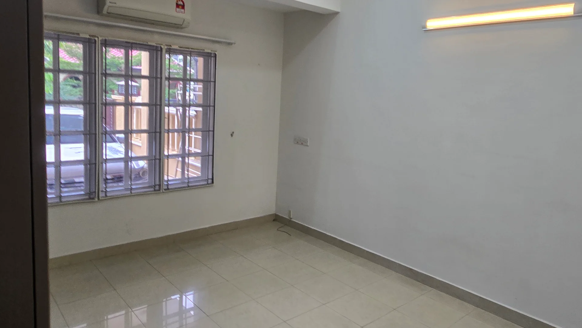 Room features: white painted walls, glossy ceramic tile flooring, 1 wall-mounted split AC, 2-pane casement windows with grilles, LED strip lighting, neutral color scheme; style: modern; view: street.