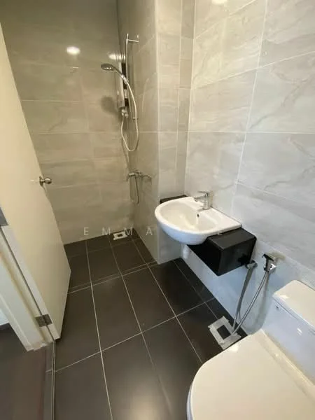 Bathroom features: grey tiled walls, white ceramic sink, wall-mounted black cabinet, chrome basin mixer faucet, one-piece toilet, shower with handheld shower head, grey tiled flooring, glass shower enclosure; style: modern.