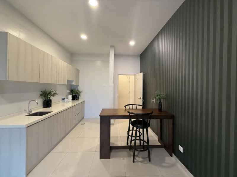 Kitchen features: light wood cabinetry, white countertop, single-bowl stainless-steel sink, chrome pull-down faucet, built-in appliances, tile flooring, green striped accent wall, recessed downlights, dining table, black wooden chair; style: modern.