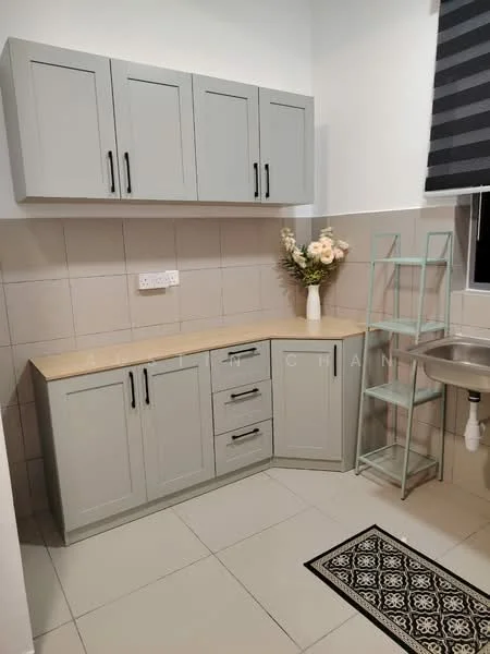Kitchen features: light grey cabinetry with flat-panel doors, laminate countertop, stainless-steel sink, chrome faucet, ceramic tile backsplash, white tiled walls, grey floor tiles, decorative flower arrangement, open shelving unit in light green, black and white patterned area rug; style: modern.