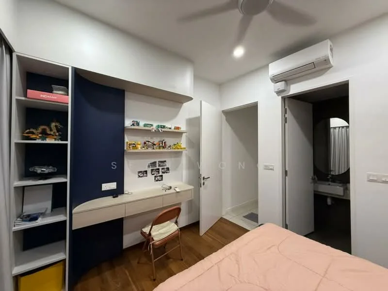 Bedroom features: wooden flooring, white painted walls, built-in shelving unit with blue accent, desk with chair, wall-mounted air conditioning unit, ceiling fan, door leading to bathroom, round mirror, bed with pink bedding; style: modern.