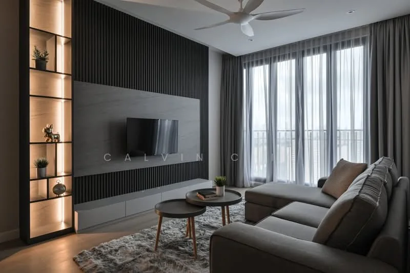 Living features: L-shape sectional sofa in grey, two round coffee tables, area rug with plush texture, wall-mounted TV, feature wall with vertical wood paneling, floor-to-ceiling windows with sheer curtains, recessed ceiling lights, 5-blade ceiling fan, decorative shelving unit with integrated lighting, houseplants in ceramic pots; style: modern.