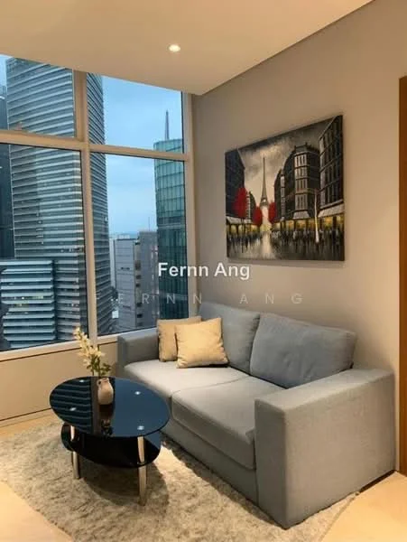Living features: grey fabric sofa, round black coffee table, area rug, floor-to-ceiling windows, city skyline view, framed artwork on wall, decorative vase with flowers, light-colored walls; style: modern; view: city.