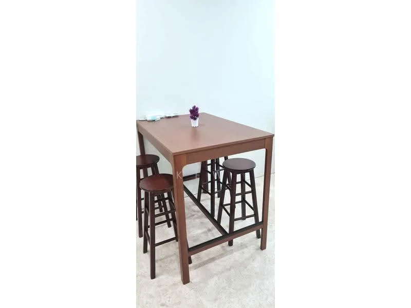 Room features: wooden dining table, four wooden bar stools, small decorative plant on table, light-colored walls, carpeted flooring; style: modern.