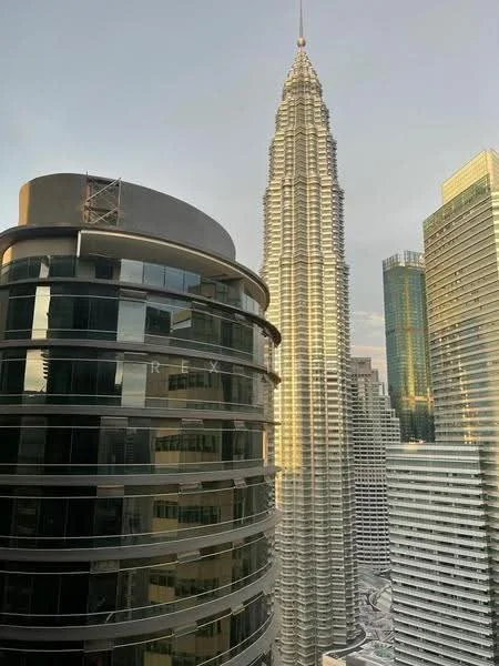 Exterior type: high-rise condominium; features: glass curtain wall, metal cladding, recessed balconies, feature lighting at night, approximately 50-storey high-rise, surrounded by urban skyline; style: modern.