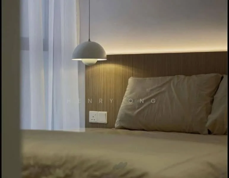Bedroom features: king-size bed, upholstered headboard, bedside lamp with pendant light, white sheer curtains, wood paneling behind the bed, wall-mounted electrical outlet, neutral bedding, soft lighting, minimalist decor; style: modern.