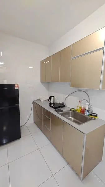 Kitchen features: black fridge, stainless-steel sink, chrome faucet, laminate cabinetry in gold finish, grey countertop, white tiled backsplash, white tiled flooring, built-in kitchen cabinets, kettle, toaster, dish soap, sponge, cleaning supplies; style: modern.