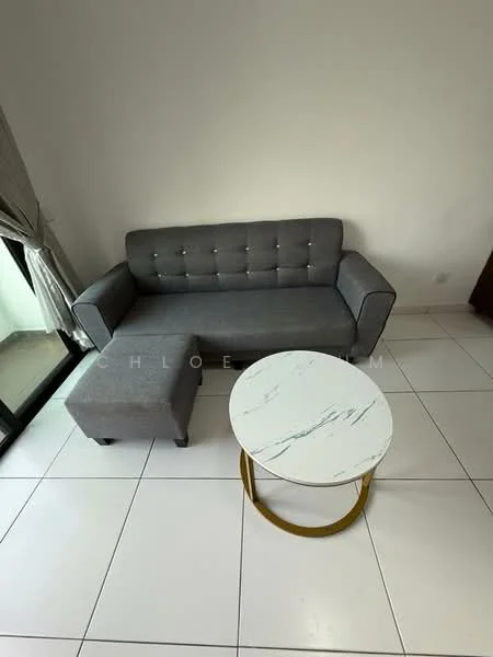 Living features: grey fabric sofa with tufted design, ottoman in matching grey fabric, round coffee table with marble top and gold metal base, white tiled flooring, floor-to-ceiling window, sheer curtains, neutral wall color; style: modern.