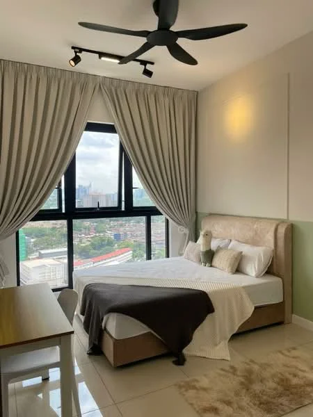 Bedroom features: king-size bed, upholstered headboard, white bedding, decorative throw pillows, light grey blanket, floor-to-ceiling windows, sheer curtains, blackout curtains, ceiling fan with light, wooden dining table, white dining chairs, tile flooring, green accent wall, decorative wall art; style: modern; view: city.