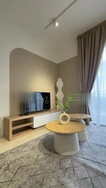 Living features: light grey painted walls, cream ceiling, recessed downlights, floor-to-ceiling windows with sheer curtains, TV console with wooden and white cabinetry, wall-mounted TV, round coffee table with wooden top, circular white base for coffee table, area rug with geometric pattern, decorative vase with greenery; style: modern.