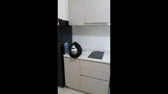 Kitchen features: grey cabinetry, white countertop, built-in stove, stainless-steel fridge, water bottle, cooking pot, drawer storage, wall-mounted cabinet; style: modern.