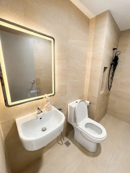 Bathroom features: wall-mounted sink, chrome basin mixer faucet, one-piece toilet, shower with handheld showerhead, tile cladding on walls, neutral beige wall tiles, large mirror with LED backlighting, floor drainage, light-colored floor tiles; style: modern.